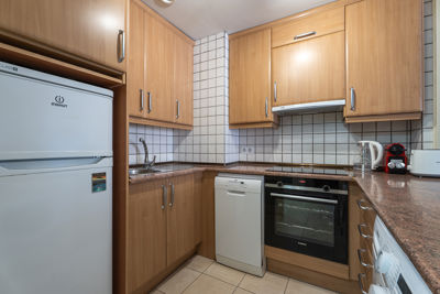 Bright and spacious kitchen in Teide View Balcones de Los Gigantes, perfect for vacationing in Los Gigantes.