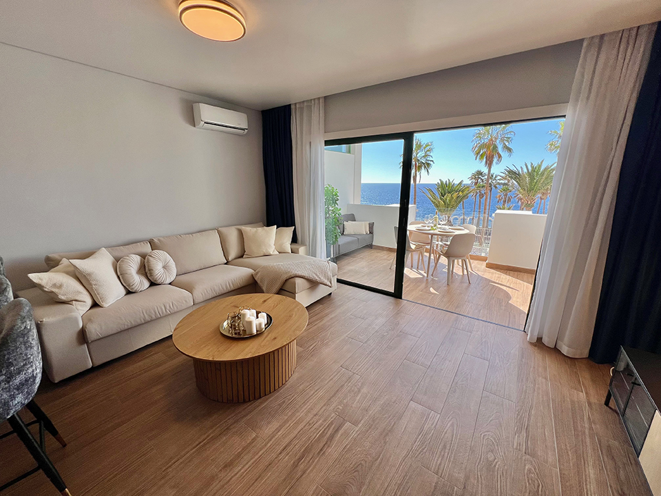 Spacious living room of Ocean View Luxury Apartment in Callao Salvaje, full of natural light.