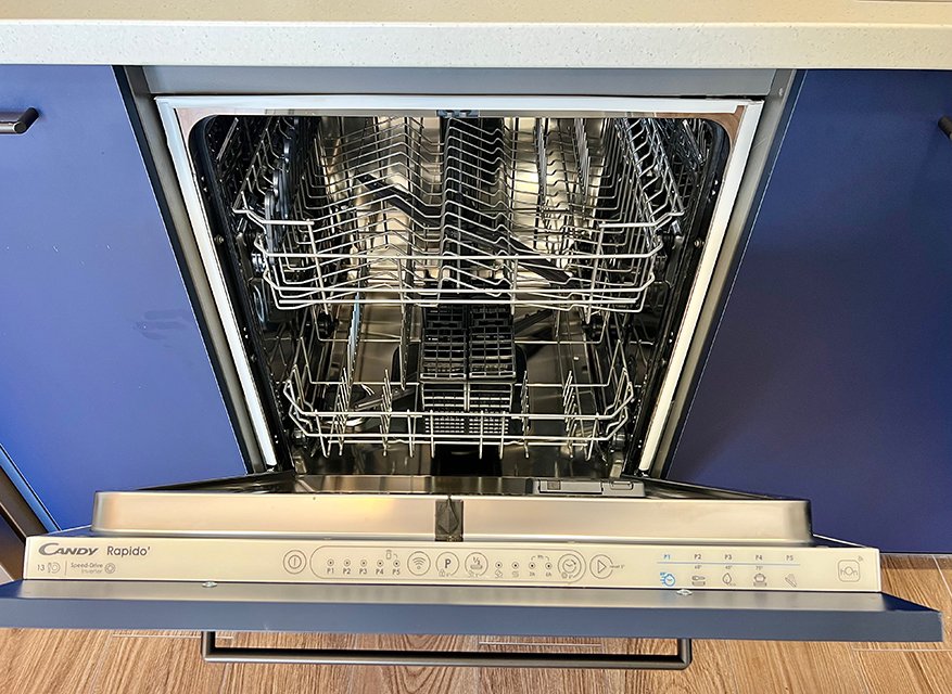 The dishwasher in the kitchenette of the apartment, a convenient solution providing more time for relaxation.