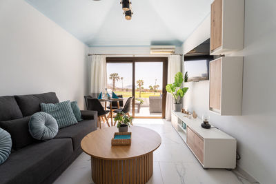 Dining area in the apartment's living room with an elegantly set table.