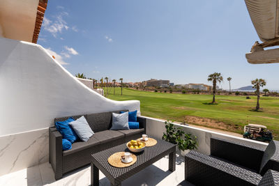 Spacious terrace with garden furniture and wide views of southern Tenerife.