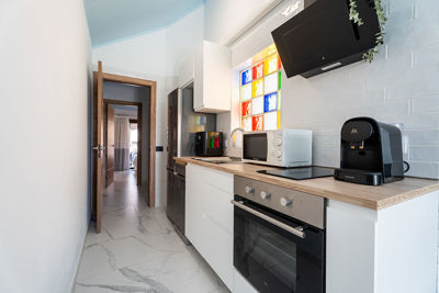 Thoughtful apartment kitchen in Amarilla Golf with high-quality appliances and a functional workspace.