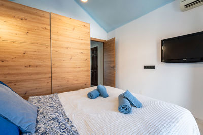 Stylish apartment bedroom with minimalist design and clear finish.