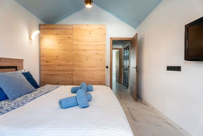 Modern bedroom with spacious wardrobe and harmonious interior color palette.