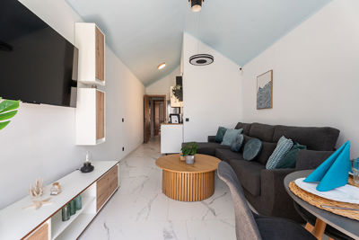 Open daytime space of the apartment connecting the living room with the kitchenette.