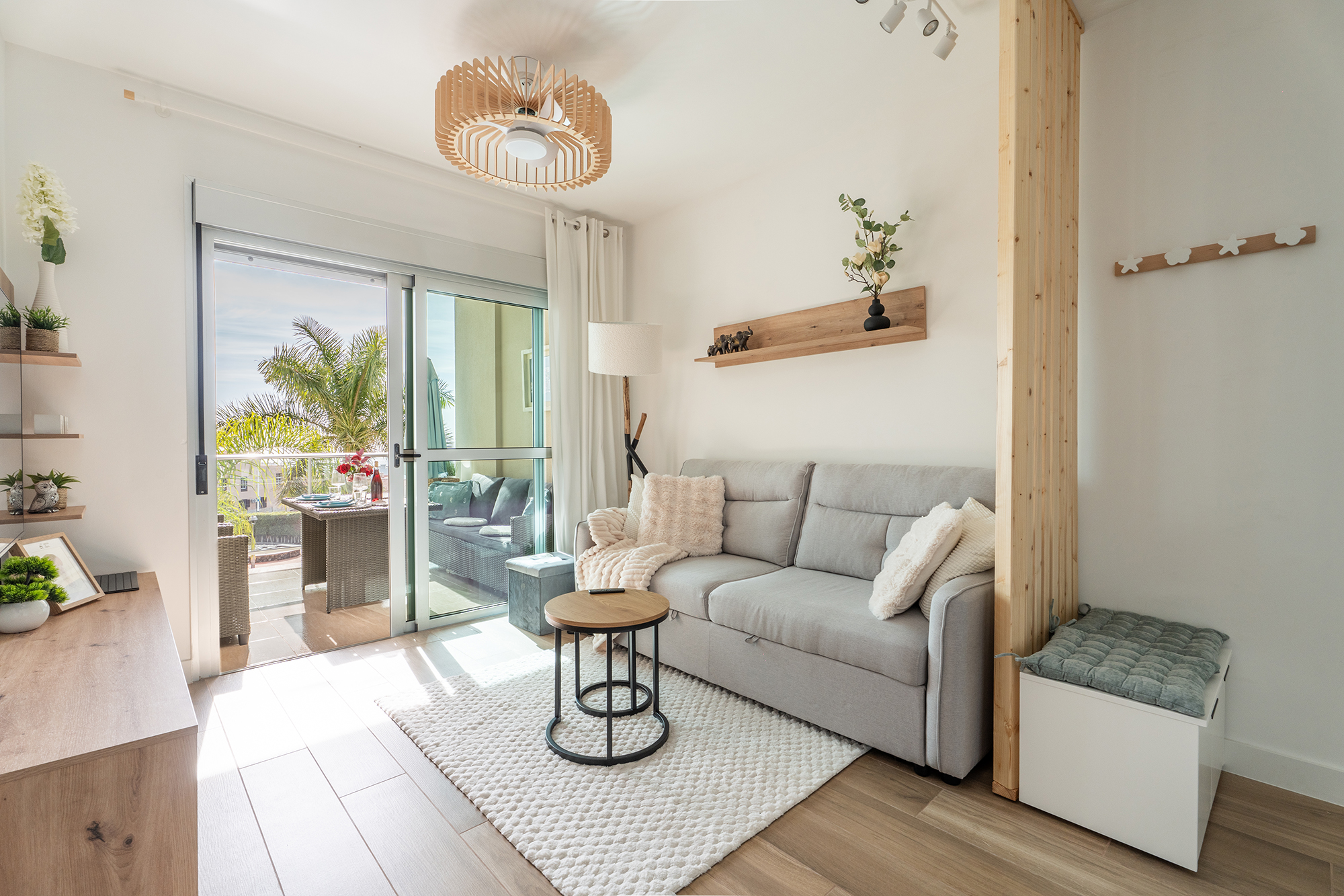 Cozy living room featuring large windows and access to the terrace in a luxury apartment in Golf del Sur, Canary Islands