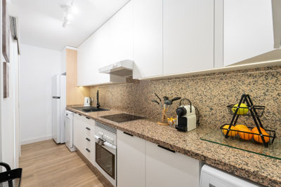 Contemporary kitchen with high-end appliances and granite countertops in a vacation rental at Golf del Sur, Canary Islands