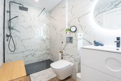 Stylish full bathroom featuring a modern shower and luxury finishes in vacation rental in Canary Islands