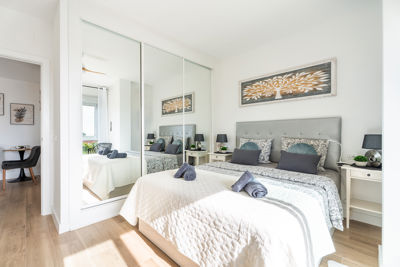 Spacious bedroom featuring a built-in wardrobe and modern decor in a vacation rental in the Canary Islands