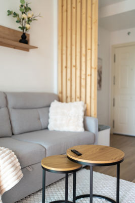Spacious living room featuring modern dining tables and outdoor views in luxury apartment in the Canary Islands
