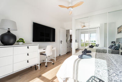 Bright living room featuring a stylish ceiling fan, modern decor in La Vista del Mar, Canary Islands