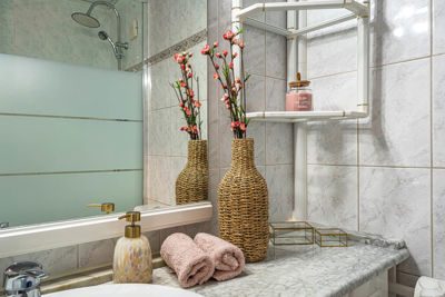 Stylish and modern bathroom featuring white tiles and decorative accents in a vacation rental in the Canary Islands, Spain.