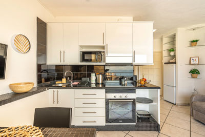 Bright and modern accessible kitchen featuring sleek appliances in the Sol del Sur Ocean View apartment, Canary Islands