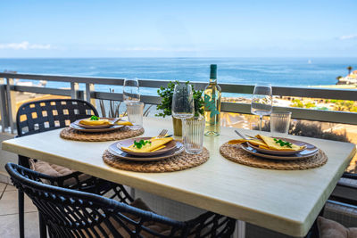 Spacious terrace furnished with outdoor seating and ocean views in a vacation rental in the Canary Islands, Spain