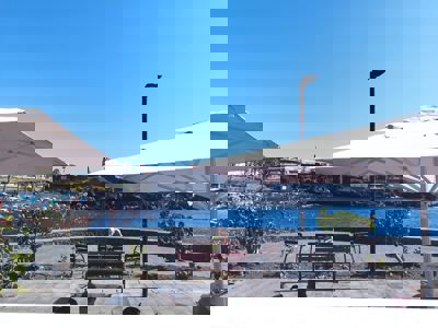 Exterior of the apartment showcasing views of the promenade and ocean, in the Canary Islands, Spain.